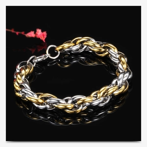Macro shot of 10mm punk twist chain bracelet in two-tone gold and silver stainless steel