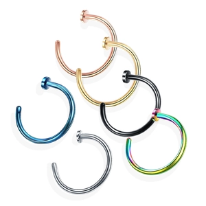 Detailed close-up of six-piece set of multicolored C-shaped stainless steel nose rings