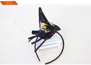 Detail of black Halloween headband featuring a mini wizard hat with mesh and star patterns