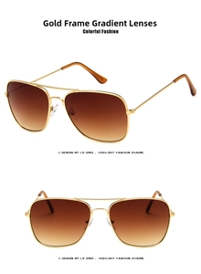 Close-up of golden aviator sunglasses with brown gradient lenses and dual bridge frame
