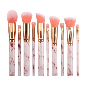 Detail of 10-piece marble makeup brush set with rose gold ferrules and pink bristles