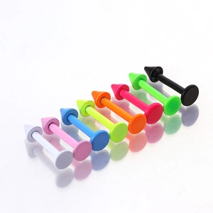 Set of 8 colorful stainless steel cone lip and cartilage studs on a mirrored surface