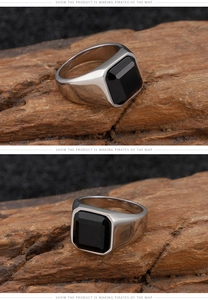 Macro shot of men's vintage stainless steel ring featuring a square black onyx gemstone