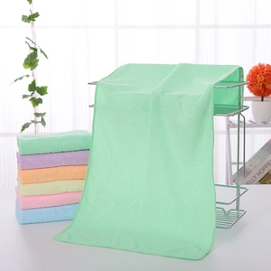 Detail of colorful microfiber towels with embossed bear pattern and soft loop texture