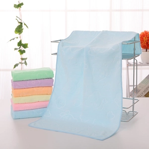 Close-up of microfiber towels with embossed bear patterns in multiple pastel colors
