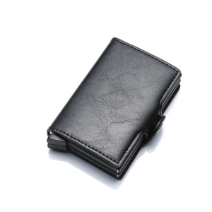 Detail view of the pop-up slider mechanism on a black PU leather aluminum card holder wallet