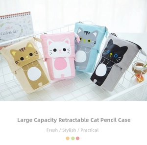 Detailed view of four colorful retractable cat pencil cases in a metal basket