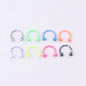 Set of eight stainless steel horseshoe rings with colorful splatter paint effect finish