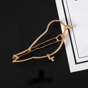 Elegant gold-tone bird shaped alloy hair clip with a minimalist hollow cutout design