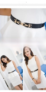 Detail view of thin black elastic waist belt with gold alloy clasp on model