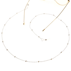 Minimalist silver copper bead eyewear chain strap displayed on a white background