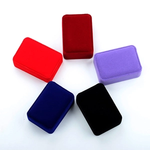 Set of five velvet jewelry boxes in red, purple, navy, and black with rounded edges
