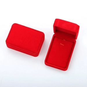 Macro shot of open and closed red velvet jewelry box for necklaces and pendants