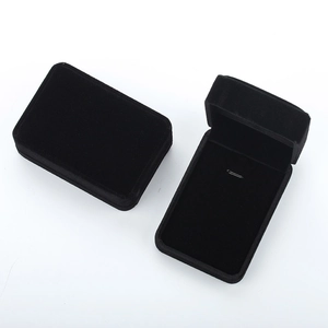Detail view of premium black velvet jewelry box showing open and closed states with metal clips