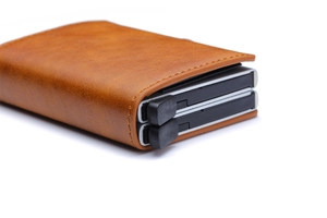 Close-up of brown PU leather card holder with dual black side sliders on white background