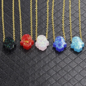 Gold Hamsa hand necklaces with colorful opal pendants in five vibrant candy colors