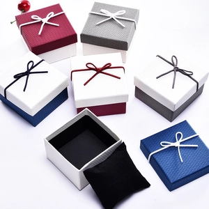 Elegant square jewelry gift boxes with ribbon bows and velvet pads in multiple colors