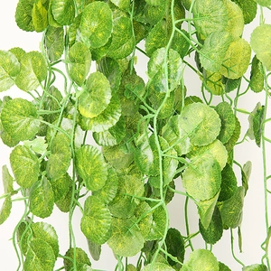Detailed view of artificial hanging vines with lush green leaves and realistic vein textures