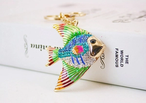 Close-up of tropical fish keychain with colorful enamel and sparkling rhinestones