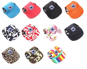 Collection of pet sun hats in various patterns like leopard, floral, and solid colors
