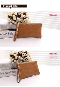 Brown crocodile pattern clutch bag with wristlet and metallic zipper detail
