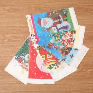 Various Christmas PVC tablecloths with Santa and reindeer patterns for holiday party decor