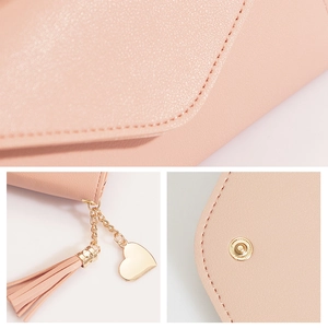 Pink long wallet for women with heart pendant tassel and pebbled leather texture