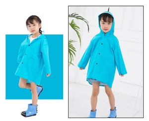 Detail of blue dinosaur raincoat for kids featuring hood with creative 3D spines