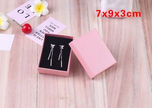 Pink jewelry gift box measuring 7x9x3cm with internal butterfly tassel earrings