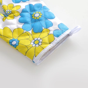 Quilted cotton oven mitt with blue and yellow floral pattern and hanging loop