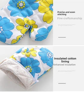 Detail view of precise diamond quilting and thick cotton insulation on floral oven mitts