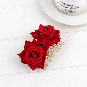 Ethnic style double red velvet rose hair comb for bridal updos on wood surface