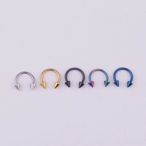 Row of five 316L stainless steel horseshoe septum rings in silver gold black and blue