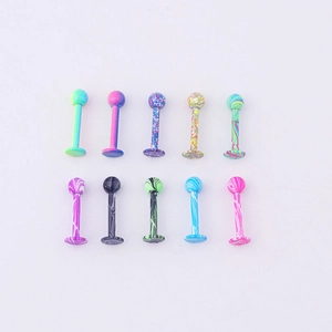 Macro shot of 10-piece colorful marble texture surgical steel lip studs and ear labret pins