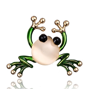Charming frog brooch with green enamel limbs and pink opal stone on white background