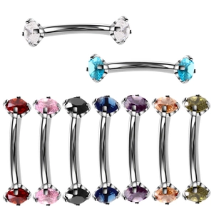 Detailed view of curved barbell eyebrow rings featuring nine different zircon stone colors
