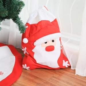 Christmas Santa Claus non-woven gift bag with drawstring on festive background