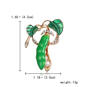 Golden pea pod brooch with green enamel leaves, white pearls and sparkling rhinestones