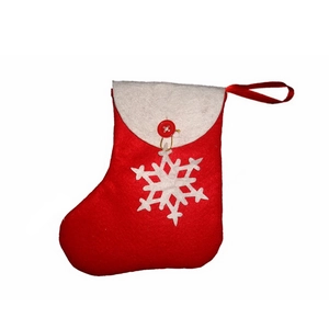 Detail of red and white felt Christmas stocking with snowflake patch and button hanger