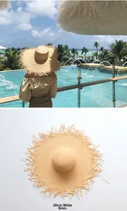 Detail of 20cm wide fringe straw sun hat for beach vacations and UV protection