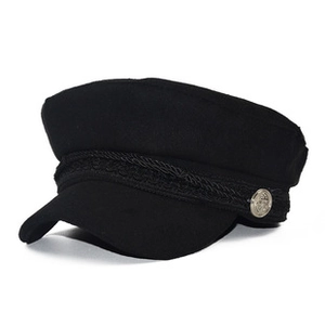 Detail of black cotton and PU sailor hat with braided rope and vintage silver buttons
