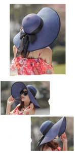 Dettagli del cappello da sole in paglia blu scuro con fiocco nero e tesa larga pieghevole