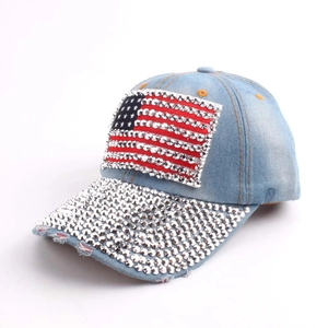 Distressed denim baseball cap with American flag rhinestone patch and silver crystal brim
