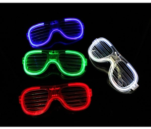 Detail view of four LED shutter glasses in blue, green, red, and white glowing colors