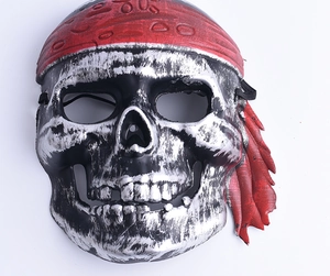 Detailed view of silver and black pirate skull mask with vintage weathered texture