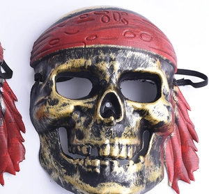 Detail of pirate skull mask showing red headband texture and gold distressed finish