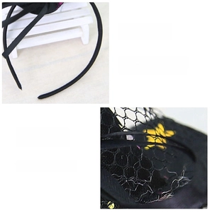 Detail of black lace Halloween headband with yellow stars and soft velvet wrapping