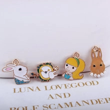 Detail of Alice in Wonderland enamel charms including rabbit and clock for DIY jewelry