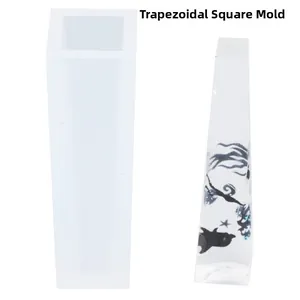 Detailed view of trapezoidal prism silicone mold and resin casting with character art