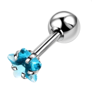 Macro view of blue star-shaped zircon stud earring with polished silver claw setting